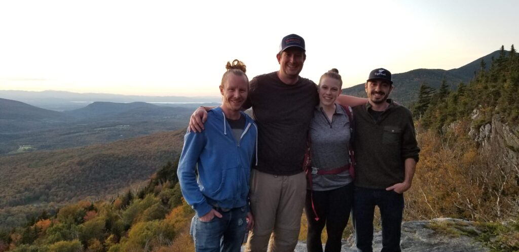 A group of friends that hiked to sunset ledge on the long trail from Lincoln gap.