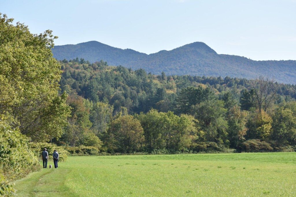 Two people hiking in the Mad River Valey. 